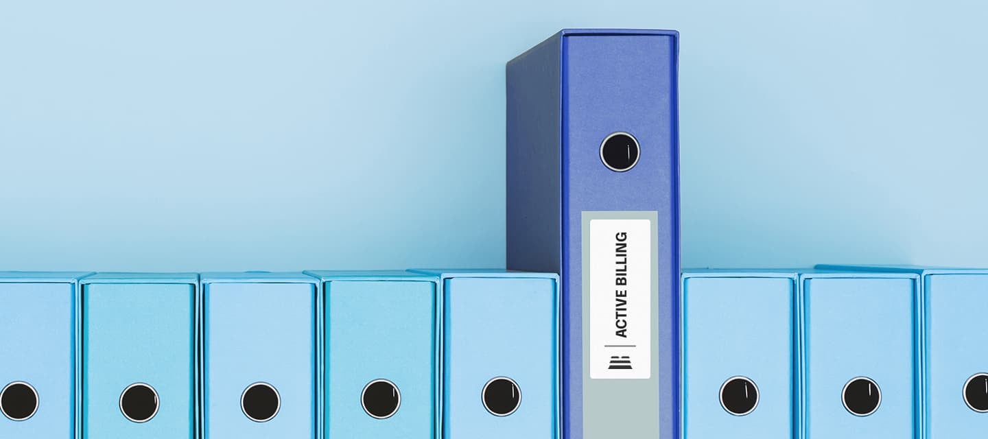 Row of blue ring binders with one dark-blue binder labeled “Active Billing” standing out against a light-blue background.