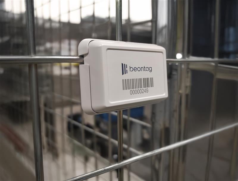 Beontag RFID tag attached to a metal grid, used for smart tracking and identification in an industrial environment.